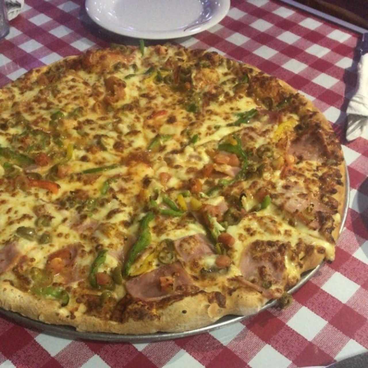 pizza mitad vegetariana mitad con jamon 