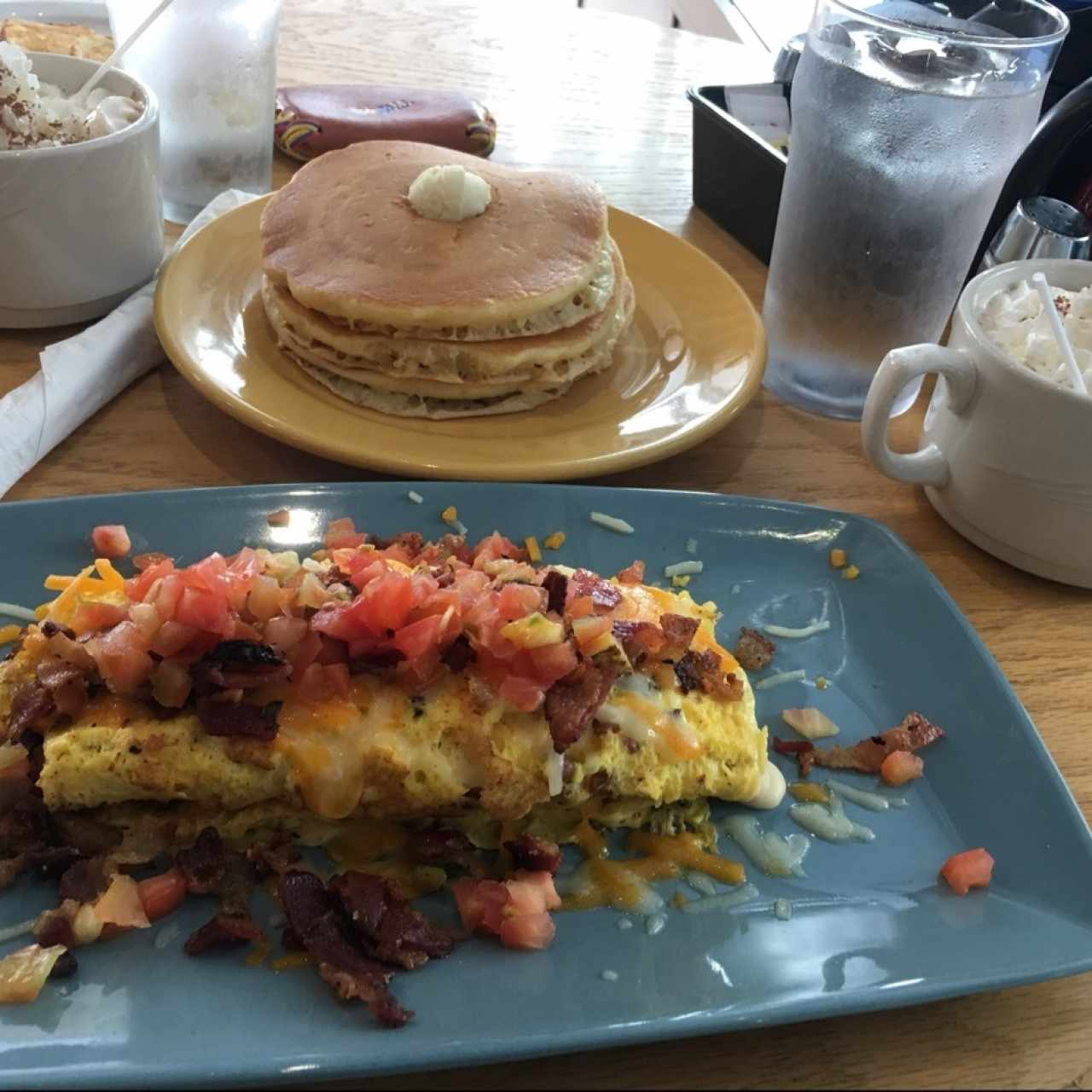 bacon temptation omelette, pan cakes , chocolate caliente