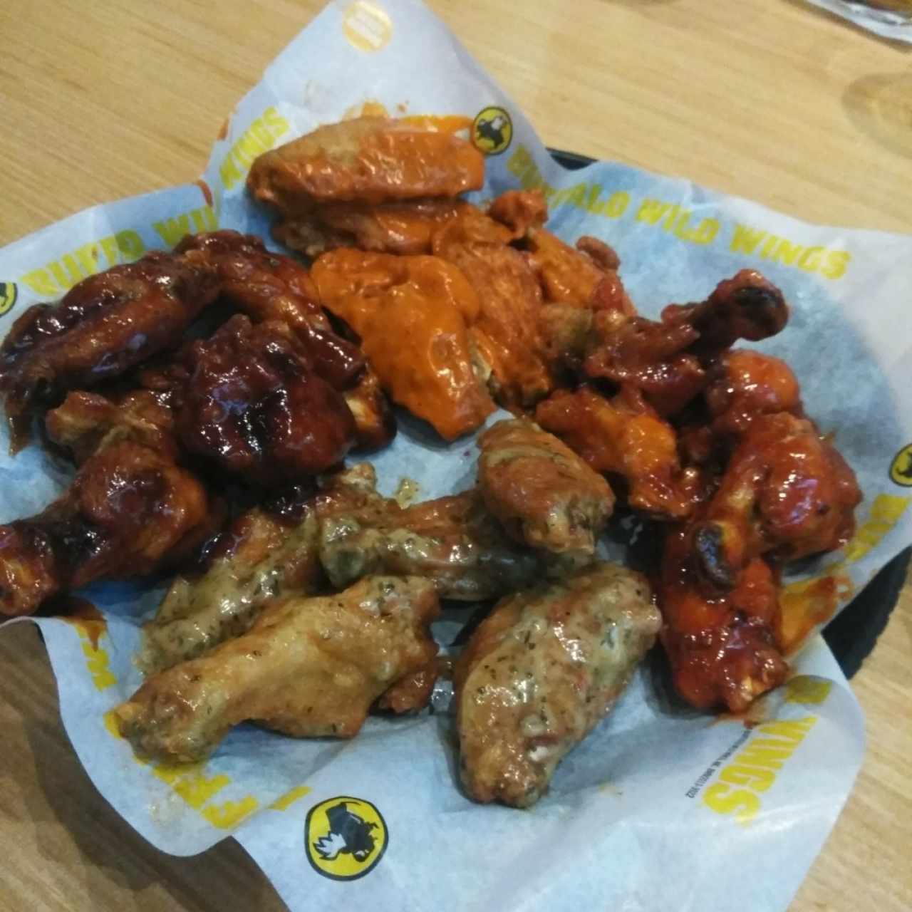 mix of wings honey bbq, garlic parm, asian zi g and spicy garlic
