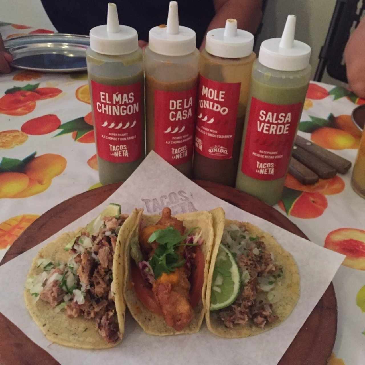 trio of carnitas, cochinita pibil, and fish tacos delectable complemented by the great sauces