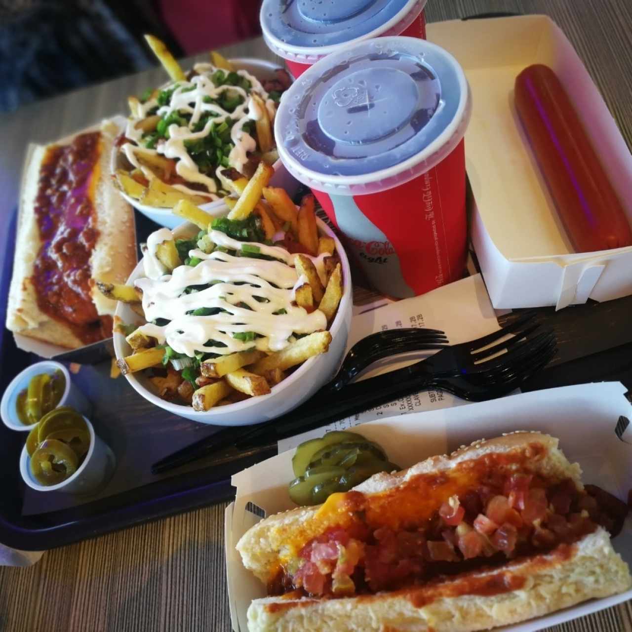 wok fries, chilli dog, sausage in the side and coke