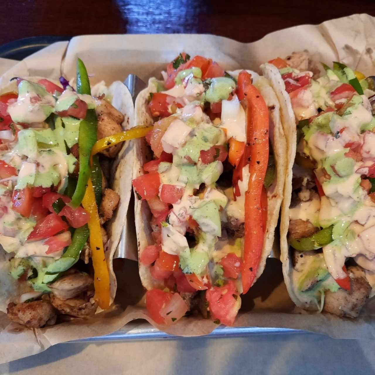 Three tacos (two fish and one chicken)