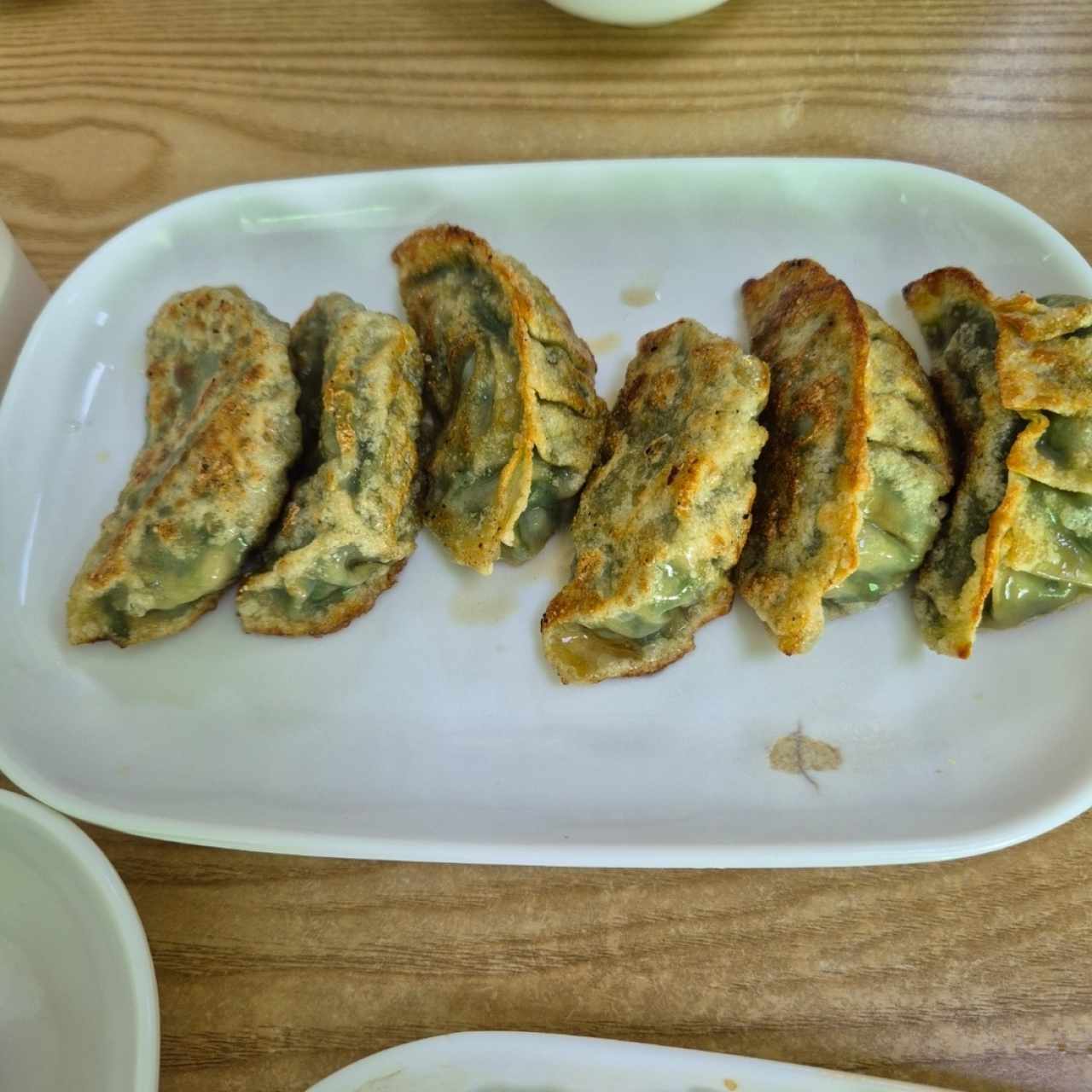 Dumpling de puerco con cebollina a la plancha