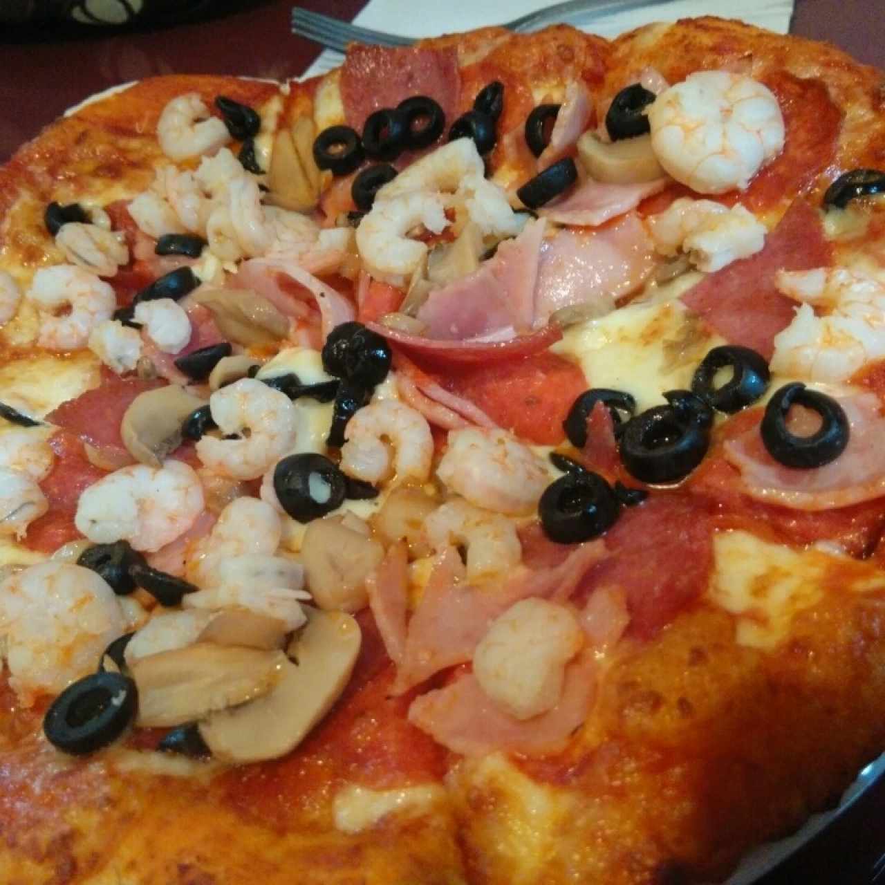 pizza con ingredientes extras