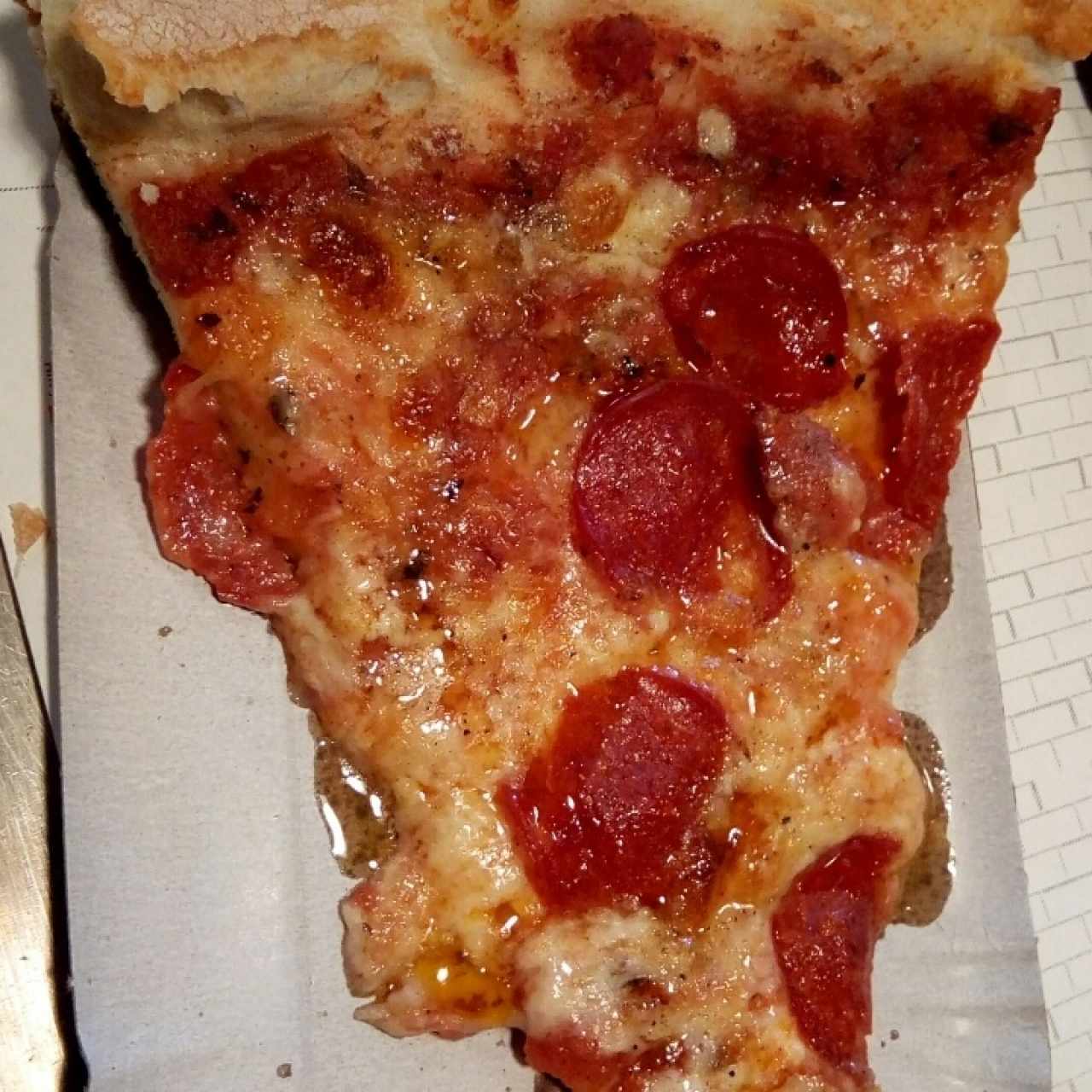 Slice de pizza con pepperoni